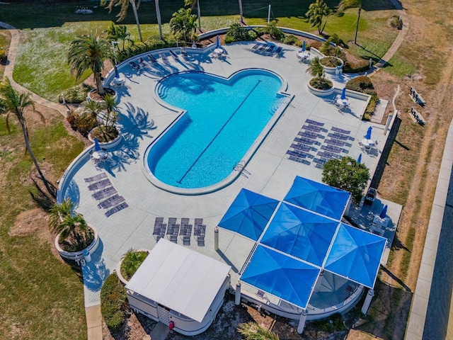 view of swimming pool featuring a water slide and a patio