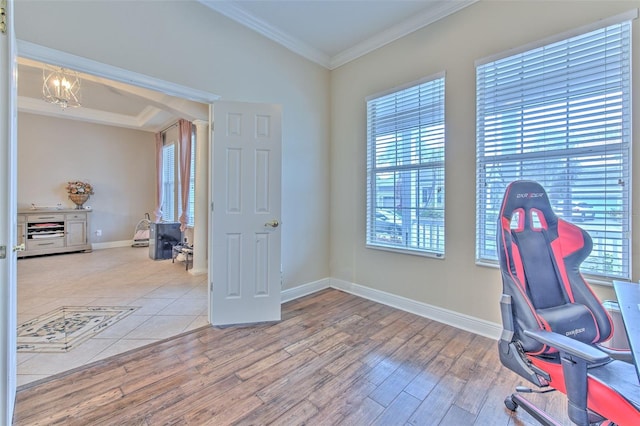 office space with a notable chandelier, wood-type flooring, and ornamental molding