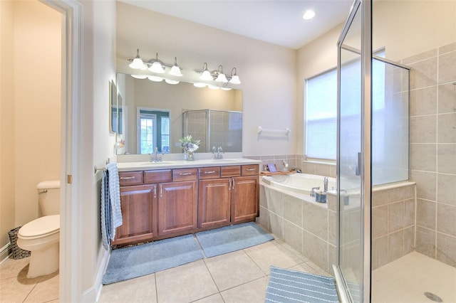 full bathroom with tile patterned floors, toilet, independent shower and bath, and vanity