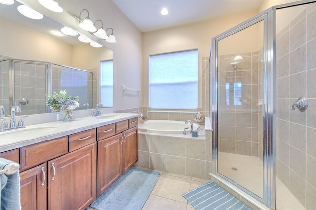 bathroom with vanity, shower with separate bathtub, and tile patterned flooring