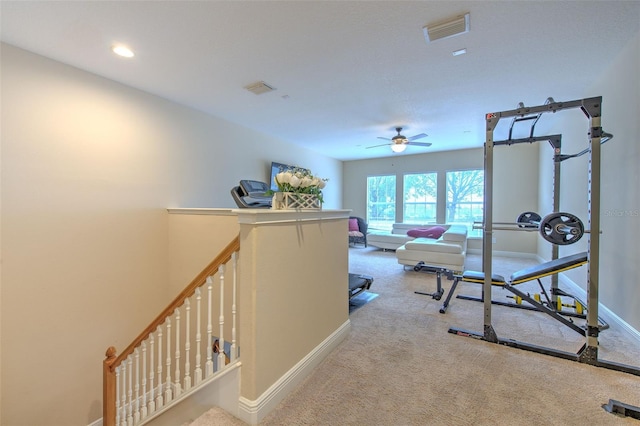 hall featuring light colored carpet