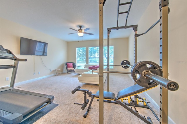 workout room featuring carpet flooring and ceiling fan