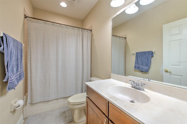 full bathroom with shower / bath combination with curtain, vanity, and toilet