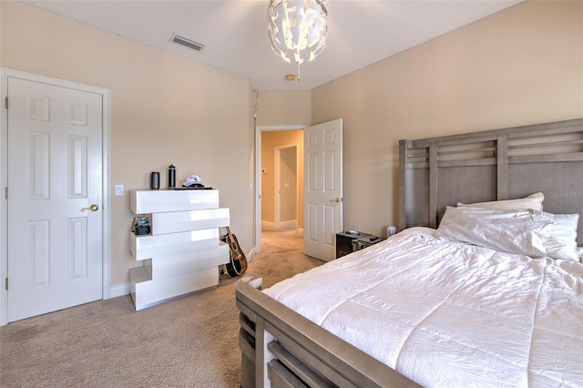 carpeted bedroom featuring a notable chandelier