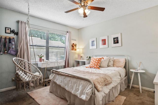 bedroom with a textured ceiling, ceiling fan, and carpet flooring