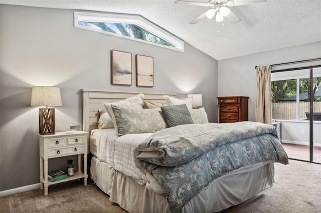 bedroom featuring vaulted ceiling, a textured ceiling, ceiling fan, and carpet flooring