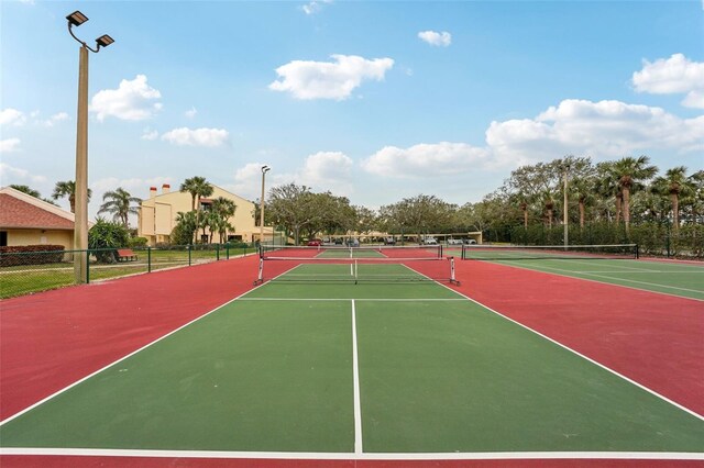 view of tennis court featuring basketball court