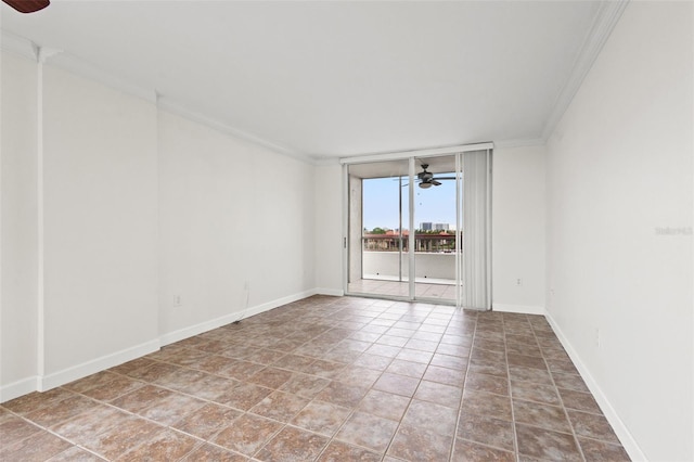 unfurnished room featuring ceiling fan and crown molding