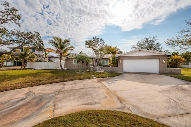 single story home with a front lawn and a garage