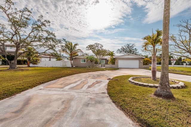 ranch-style home with a front yard and a garage