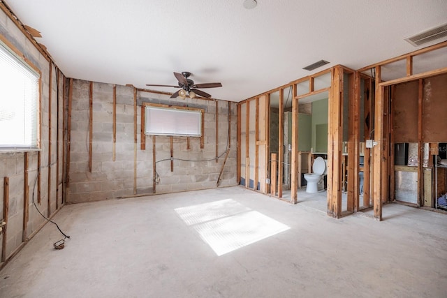 basement with ceiling fan