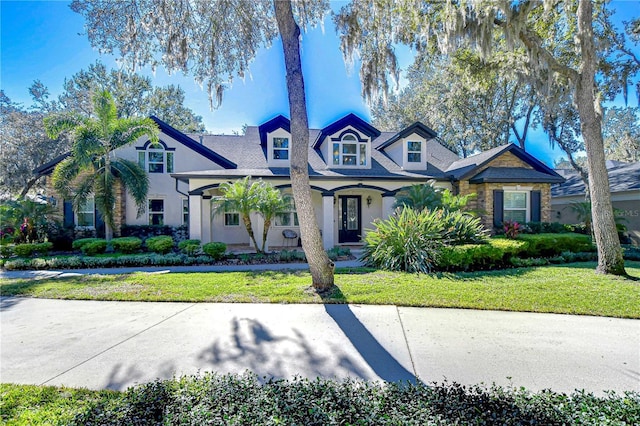 view of front of home with a front lawn