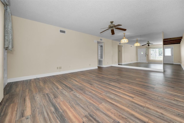 unfurnished living room featuring dark hardwood / wood-style flooring, a textured ceiling, and ceiling fan