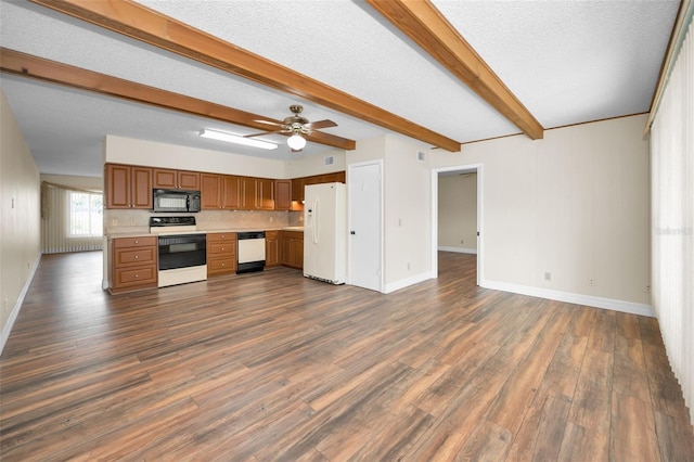 kitchen with beamed ceiling, dark hardwood / wood-style flooring, white appliances, ceiling fan, and a textured ceiling