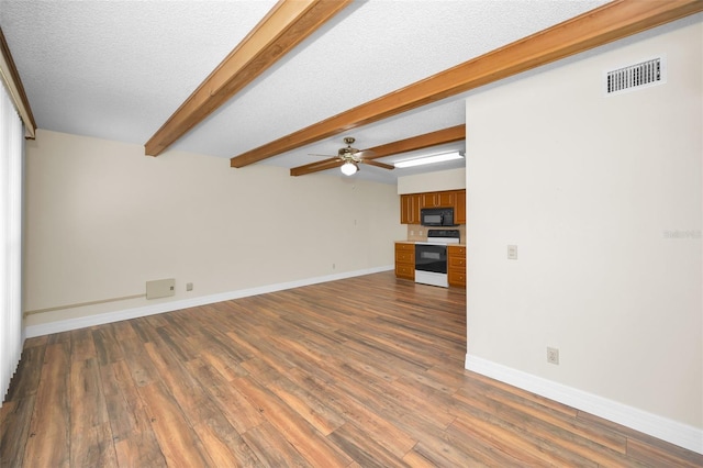 unfurnished living room with beamed ceiling, ceiling fan, dark hardwood / wood-style floors, and a textured ceiling