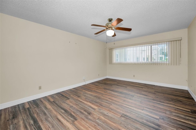 spare room with dark wood-type flooring, ceiling fan, and a textured ceiling