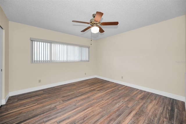 unfurnished room with ceiling fan, dark hardwood / wood-style floors, and a textured ceiling