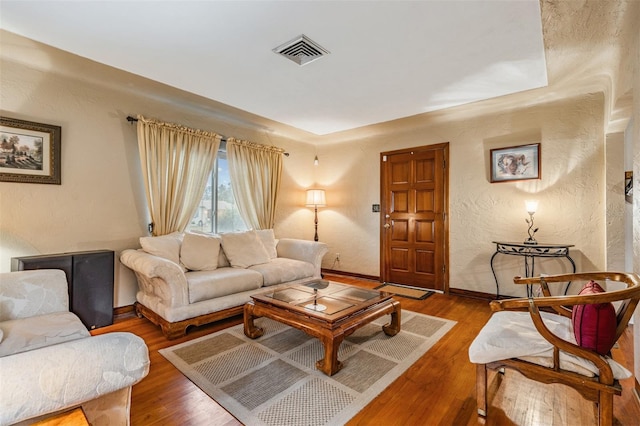 living room with wood-type flooring