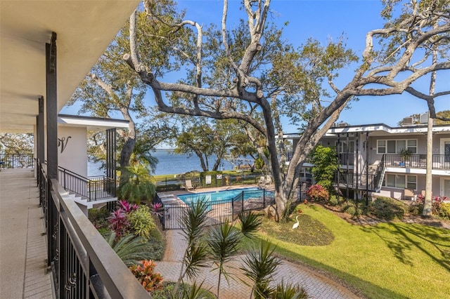 exterior space featuring a water view and a yard