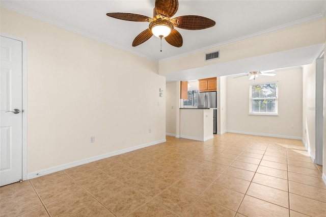 unfurnished living room with ceiling fan, light tile patterned flooring, and ornamental molding