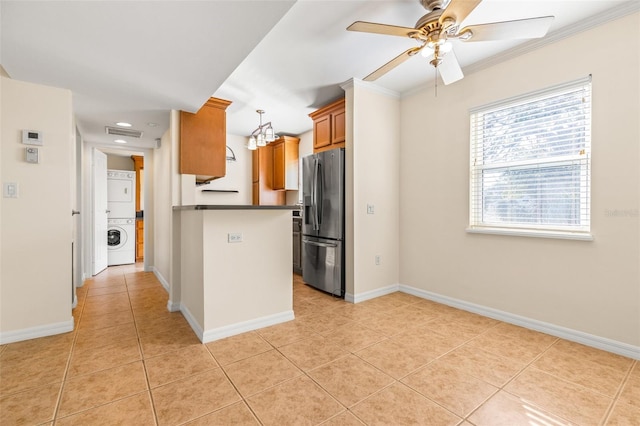 kitchen featuring stainless steel fridge with ice dispenser, light tile patterned floors, stacked washer and clothes dryer, kitchen peninsula, and ceiling fan