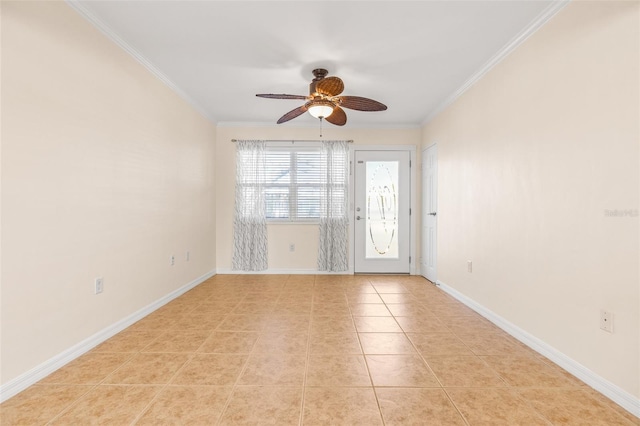 spare room with ceiling fan, light tile patterned floors, and crown molding