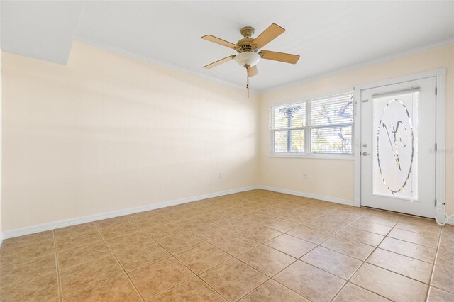 foyer with ceiling fan, light tile patterned floors, and ornamental molding