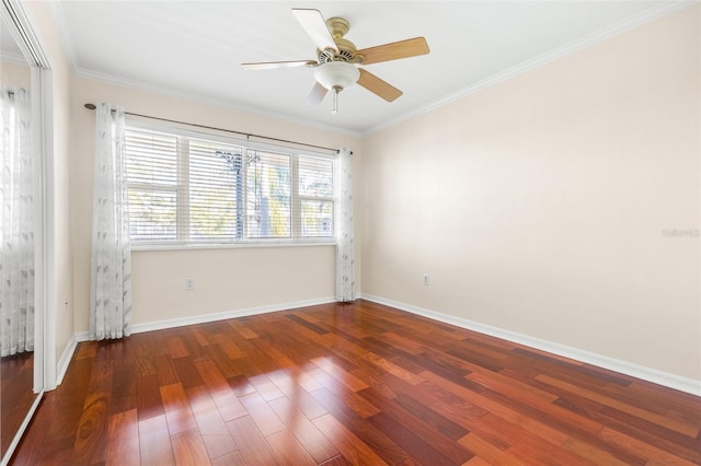 unfurnished room featuring ceiling fan, dark hardwood / wood-style flooring, and ornamental molding