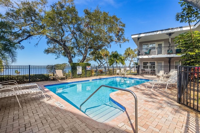 view of swimming pool featuring a patio area