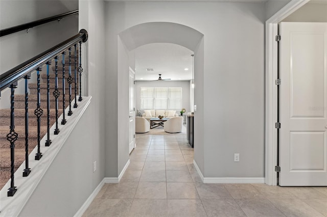 hallway featuring light tile patterned floors