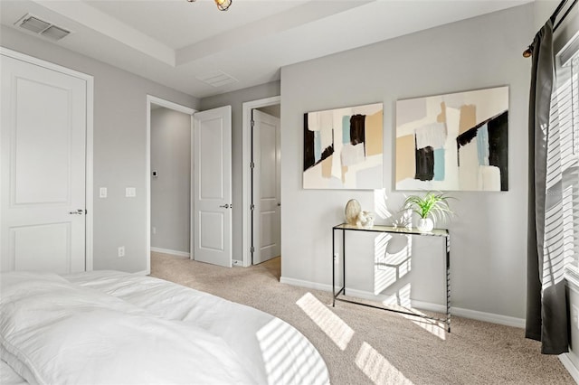 bedroom featuring light colored carpet and multiple windows