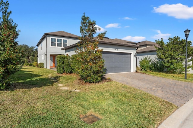 view of front of house with a front lawn and a garage