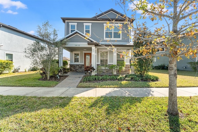 craftsman house featuring a front yard