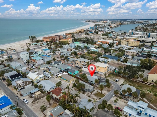 bird's eye view featuring a water view and a view of the beach