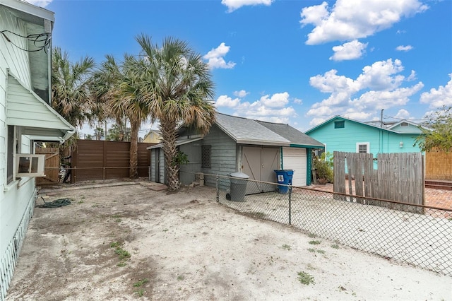 view of side of property with a garage and an outdoor structure