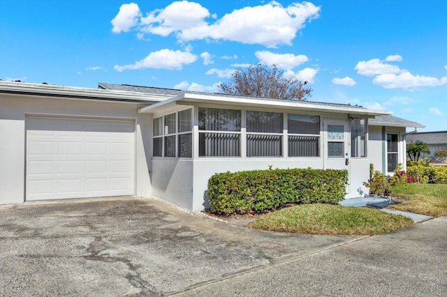 ranch-style home with a garage