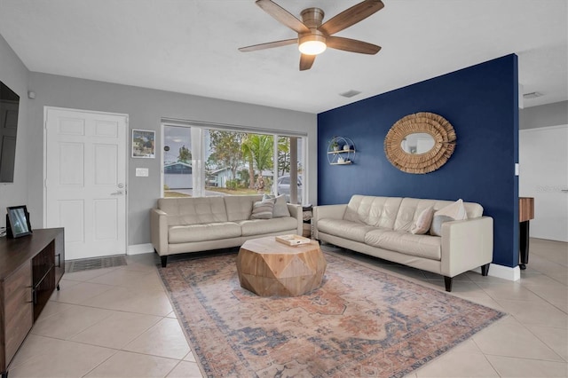 tiled living room featuring ceiling fan