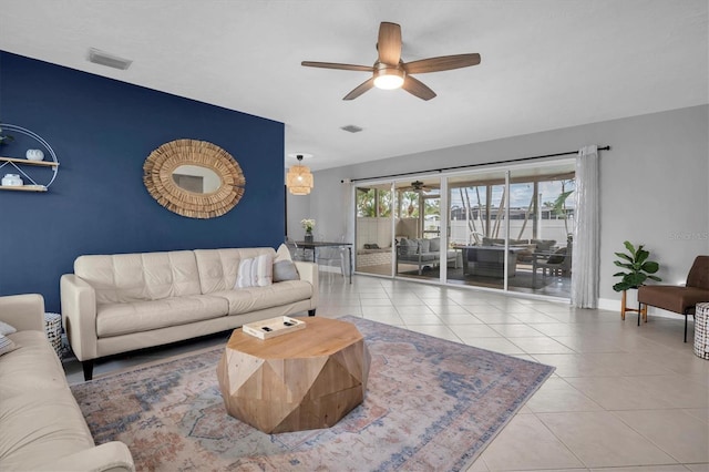 tiled living room featuring ceiling fan