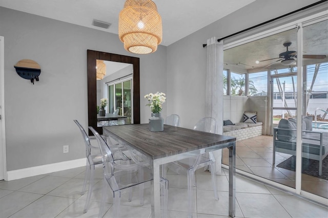 tiled dining room with ceiling fan