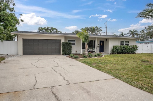 single story home with a front lawn and a garage