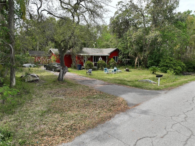 view of home's community with a yard