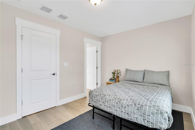 bedroom with hardwood / wood-style flooring