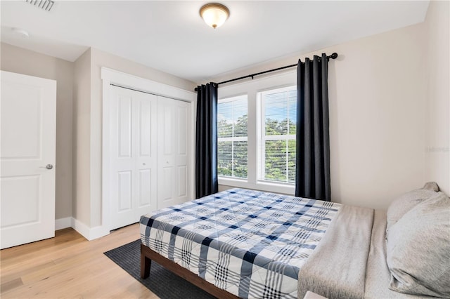 bedroom featuring a closet and light hardwood / wood-style floors