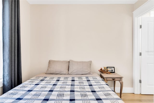 bedroom featuring wood-type flooring