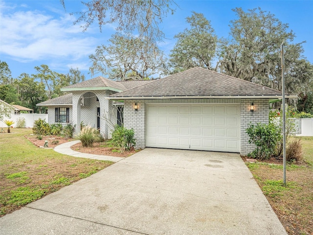 view of front of house featuring a front yard and a garage