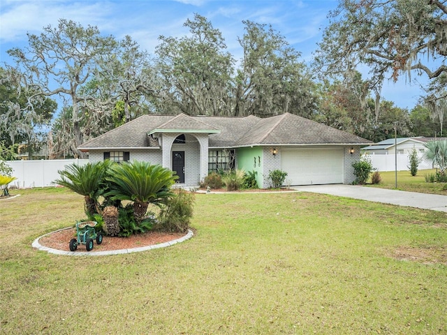 ranch-style home with a front lawn and a garage