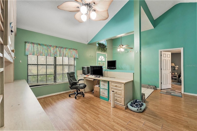 office featuring light hardwood / wood-style floors, high vaulted ceiling, and ceiling fan