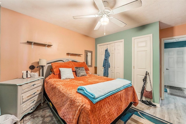 bedroom with ceiling fan and hardwood / wood-style flooring