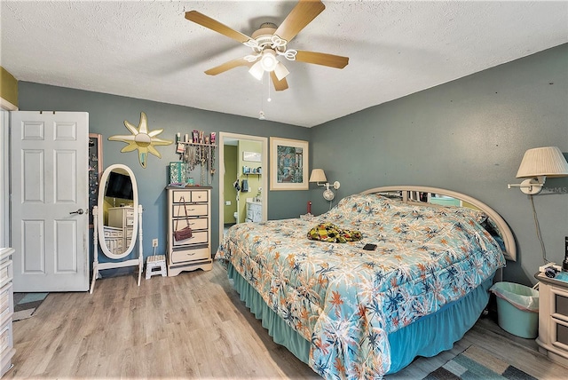 bedroom featuring a textured ceiling, ceiling fan, and light hardwood / wood-style floors