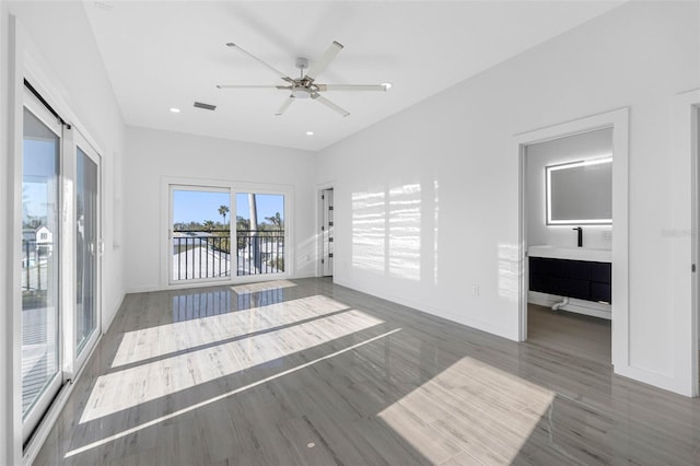 unfurnished room featuring ceiling fan and dark hardwood / wood-style flooring